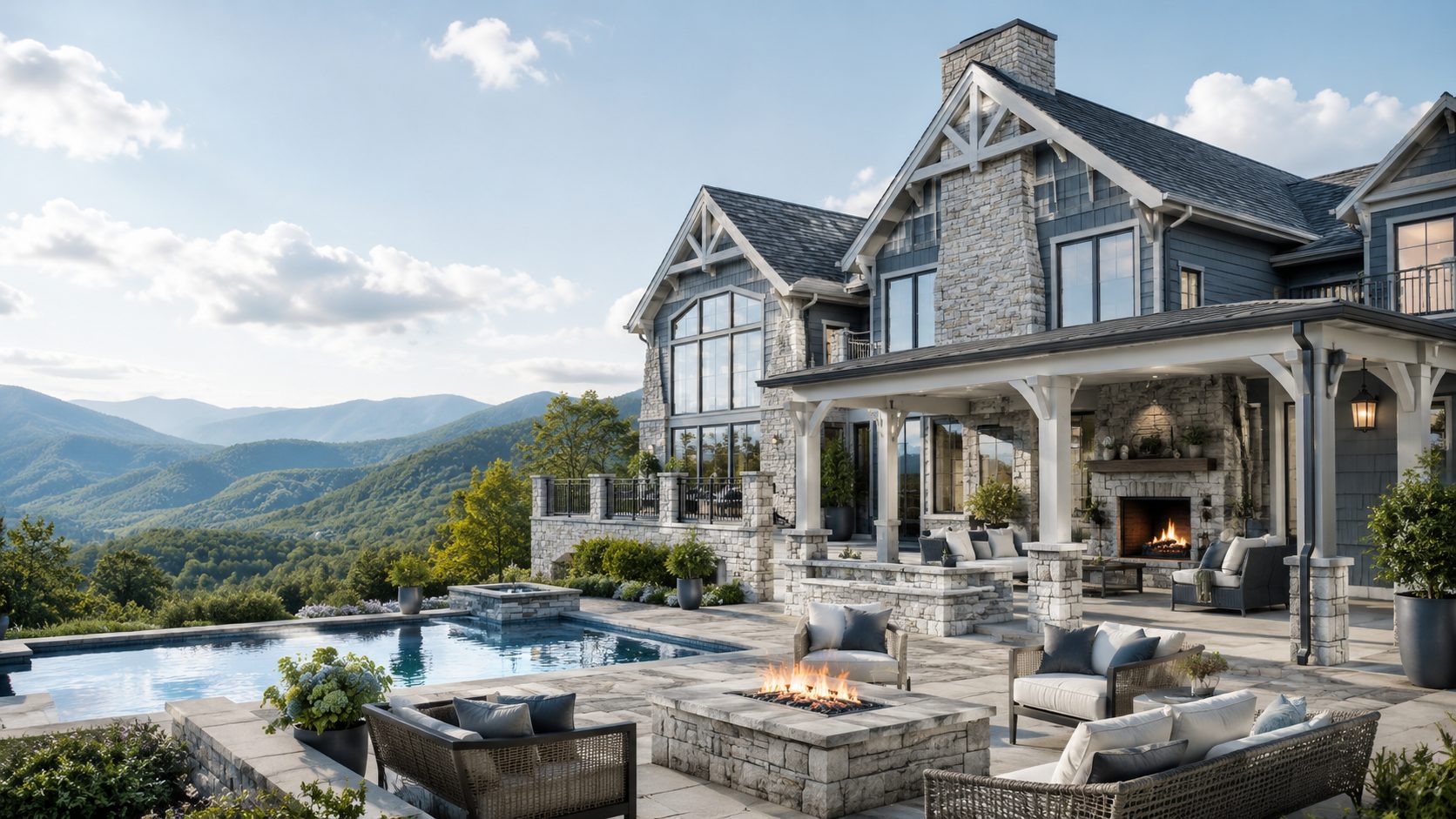 Luxury Smoky Mountain retreat with blue-gray siding, stone architecture, pool, outdoor fireplace, and panoramic mountain views.