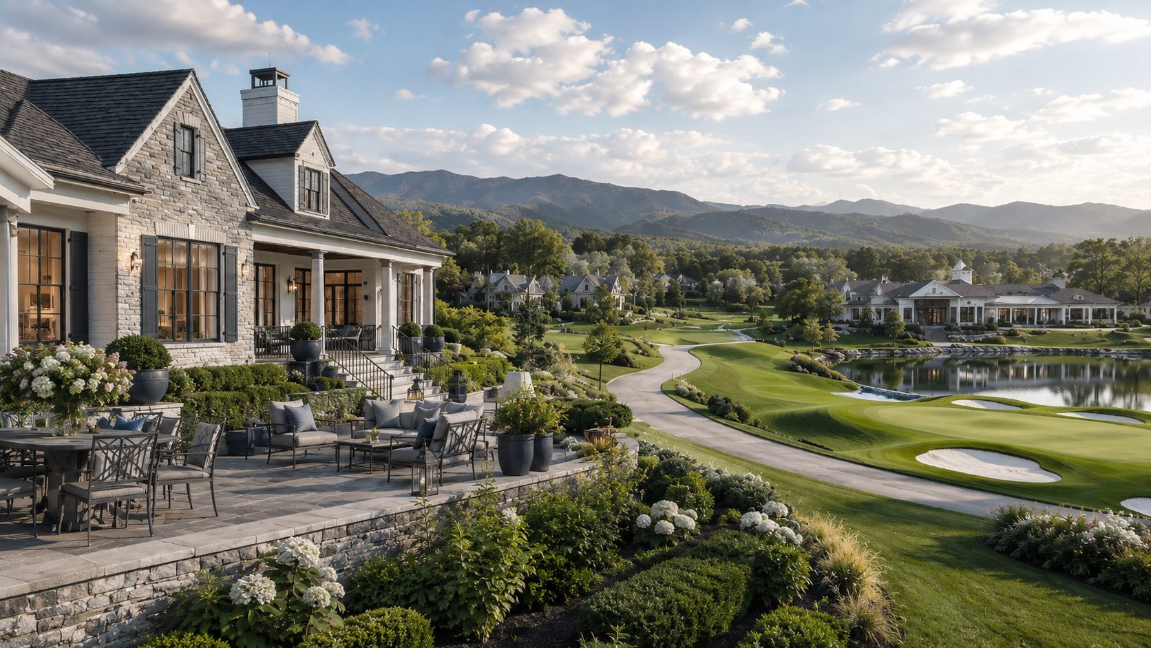 Luxury golf course residence with blue-gray accents, landscaped terrace, clubhouse, mountain views, and water features.